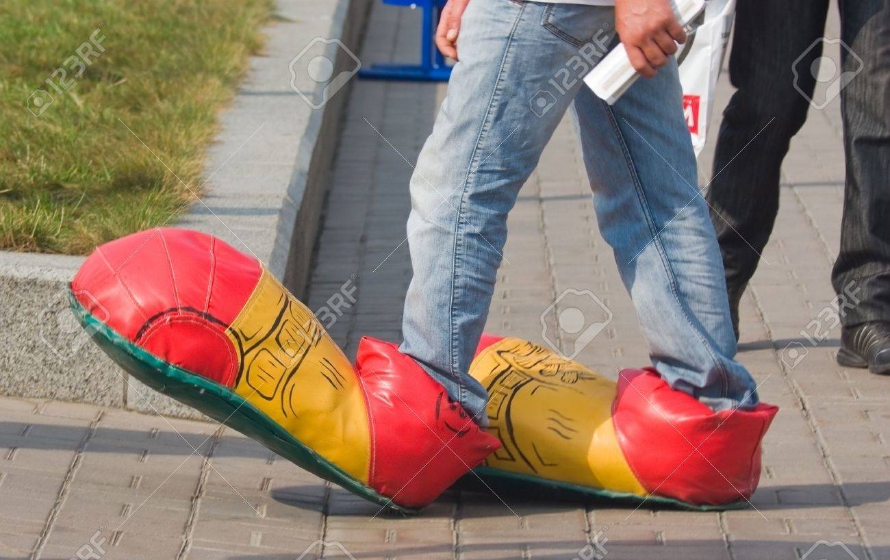 5941496-pedestrian-on-the-street-in-clown-shoes.jpg
